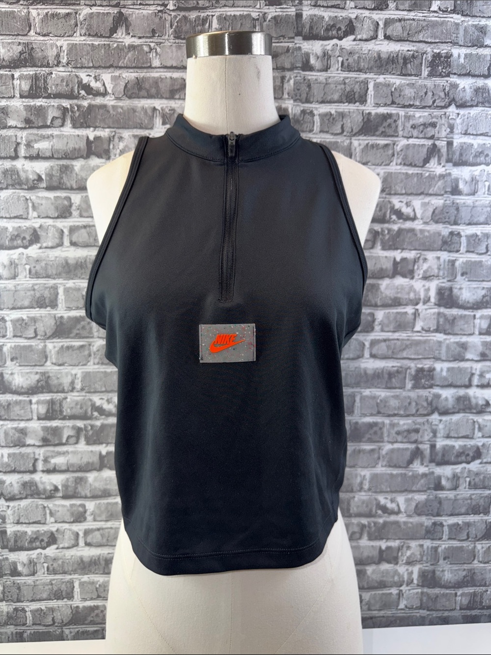 Nike Black Mock-Neck Sleeveless Zip Crop Tank with Orange Logo